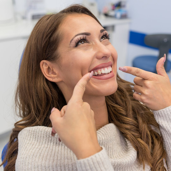 woman smiling getting mouth fitted woman smiling getting mouth fitted